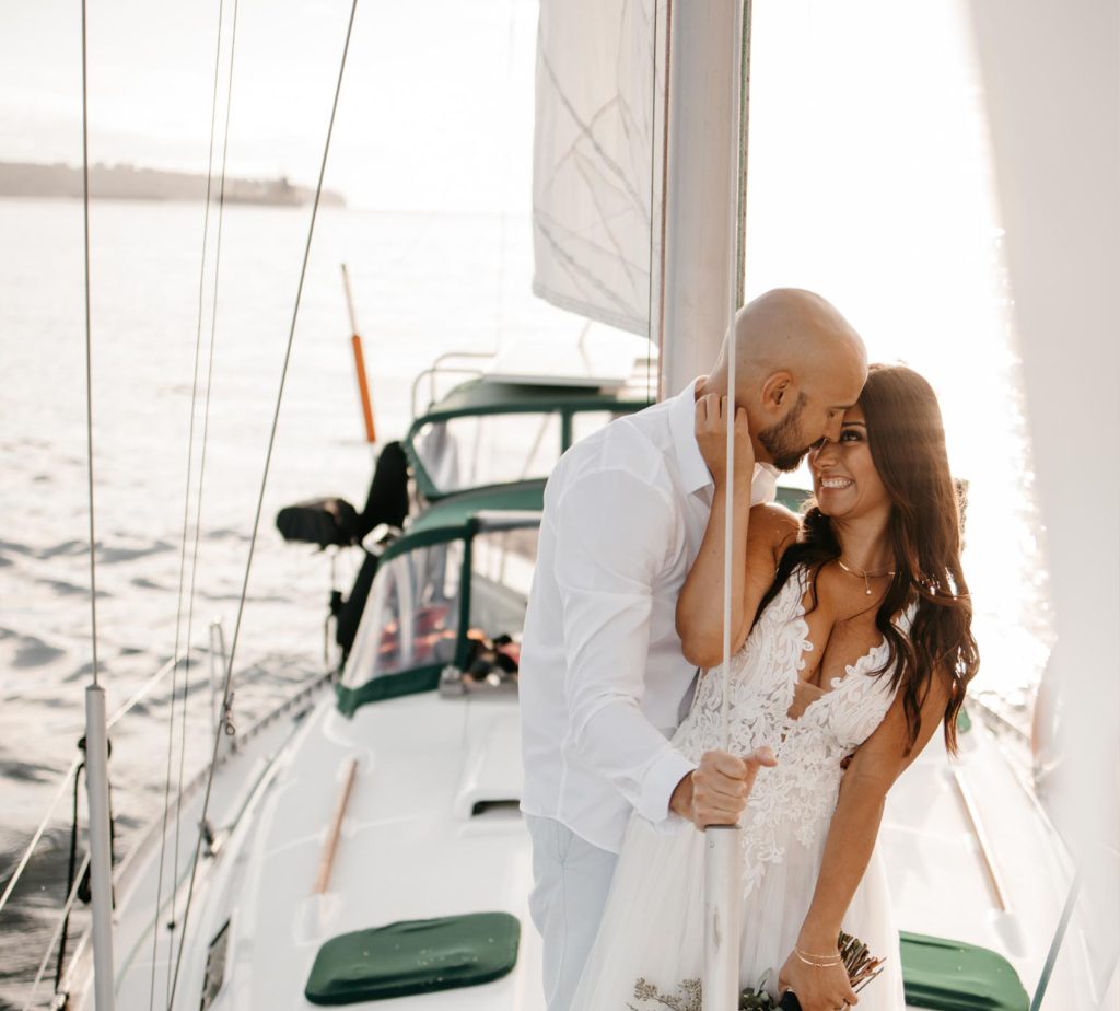 Couples engagement shoot and photos taken on a sailboat in Vancouver Harbour