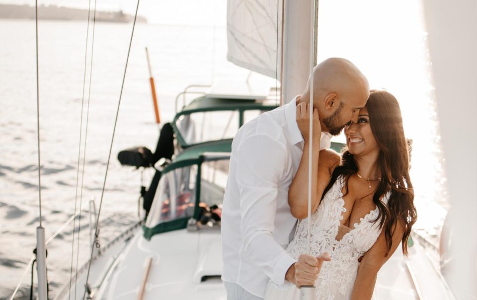 Couples engagement shoot and photos taken on a sailboat in Vancouver Harbour