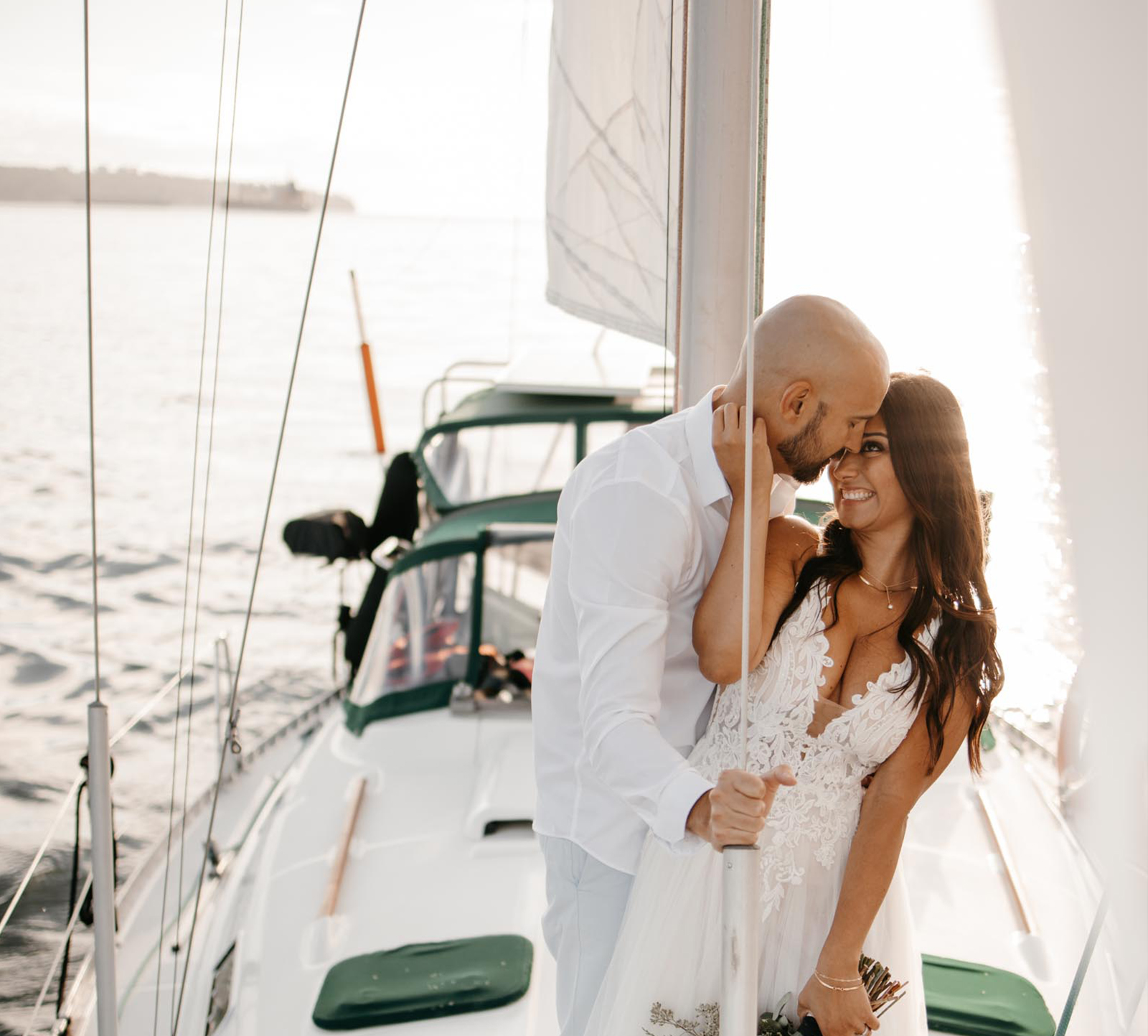 Couples engagement shoot and photos taken on a sailboat in Vancouver Harbour