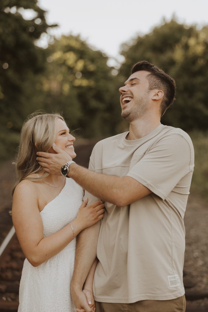 Engagement photoshoot in Vancouver BC at Crescent beach at sunset with a madly in love couple