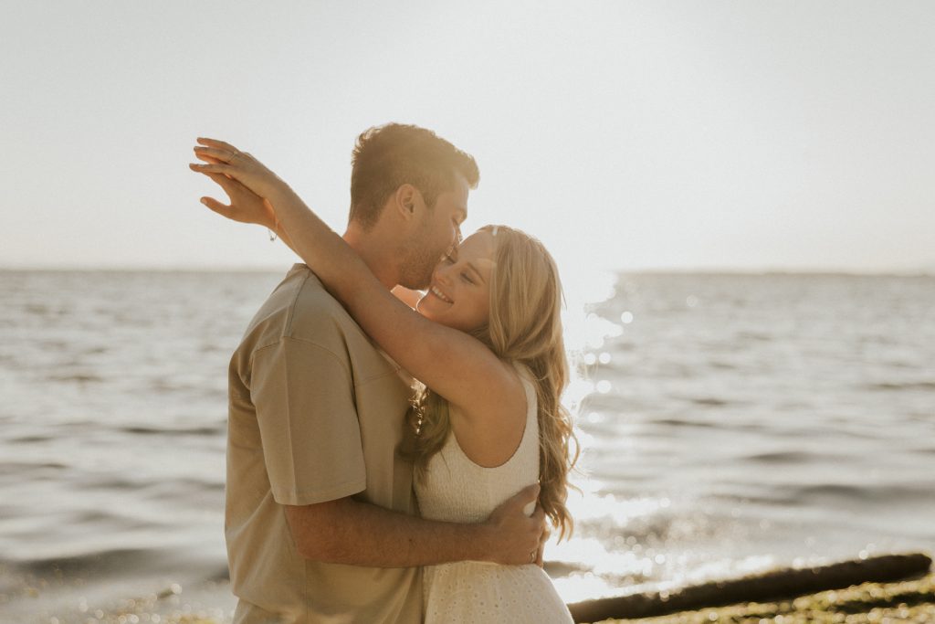 Engagement photoshoot in Vancouver BC at Crescent beach at sunset with a madly in love couple