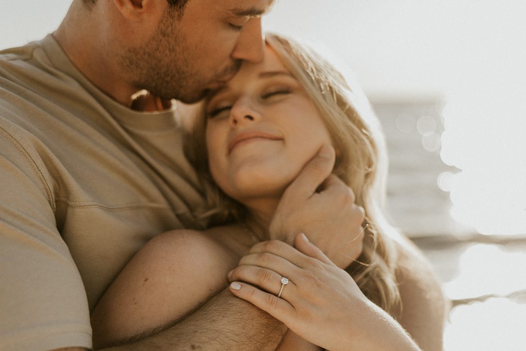 Engagement photoshoot in Vancouver BC at Crescent beach at sunset with a madly in love couple