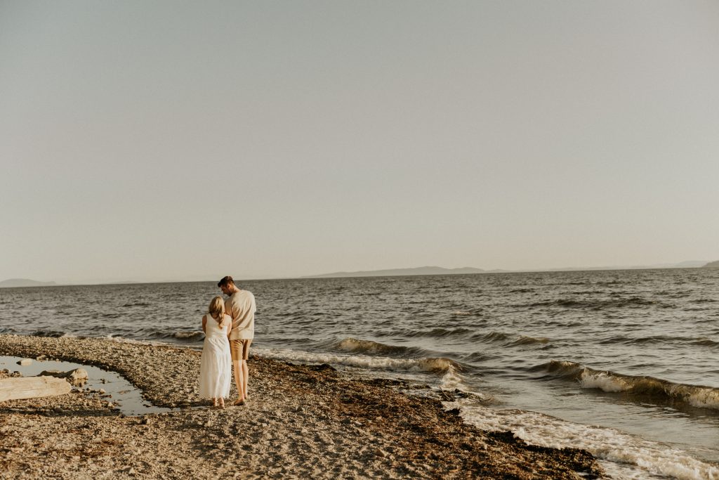 Engagement photoshoot in Vancouver BC at Crescent beach at sunset with a madly in love couple