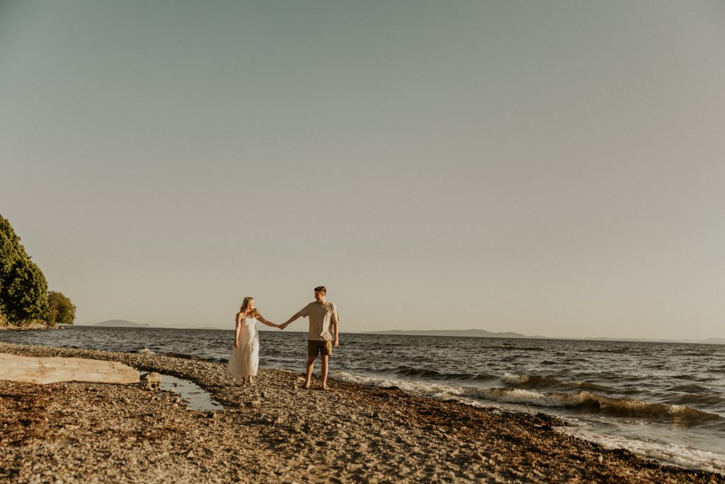 Engagement photoshoot in Vancouver BC at Crescent beach at sunset with a madly in love couple