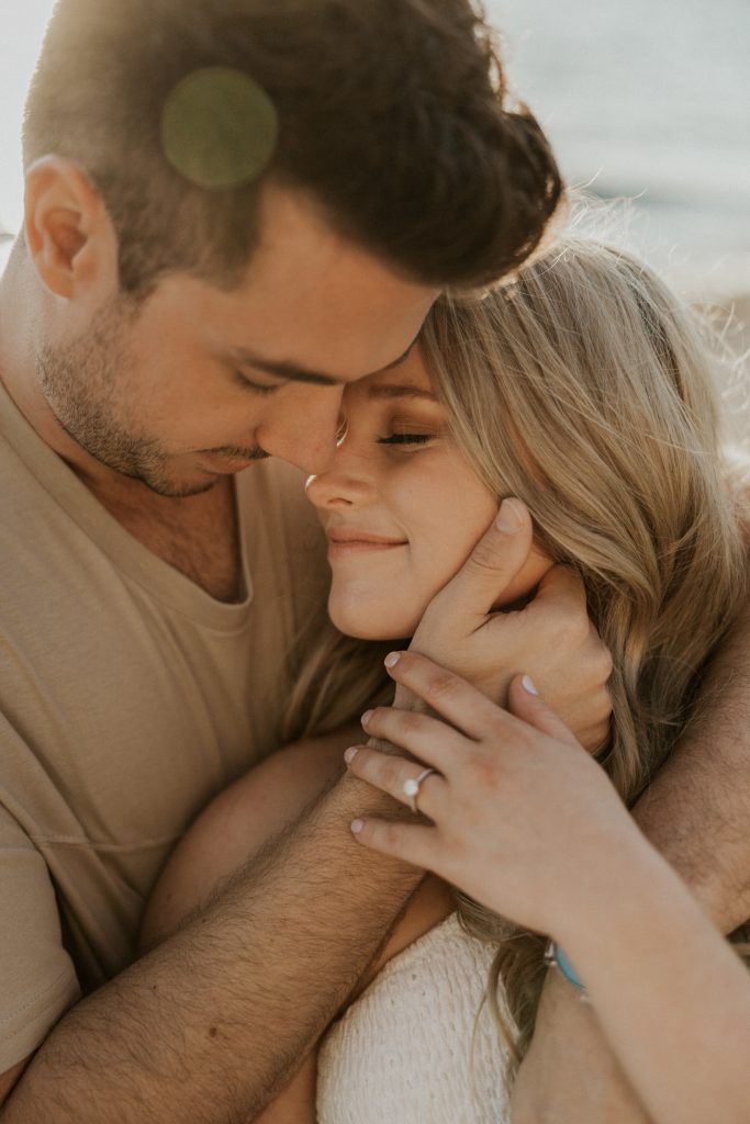 Engagement photoshoot in Vancouver BC at Crescent beach at sunset with a madly in love couple
