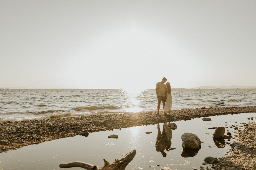 Engagement photoshoot in Vancouver BC at Crescent beach at sunset with a madly in love couple