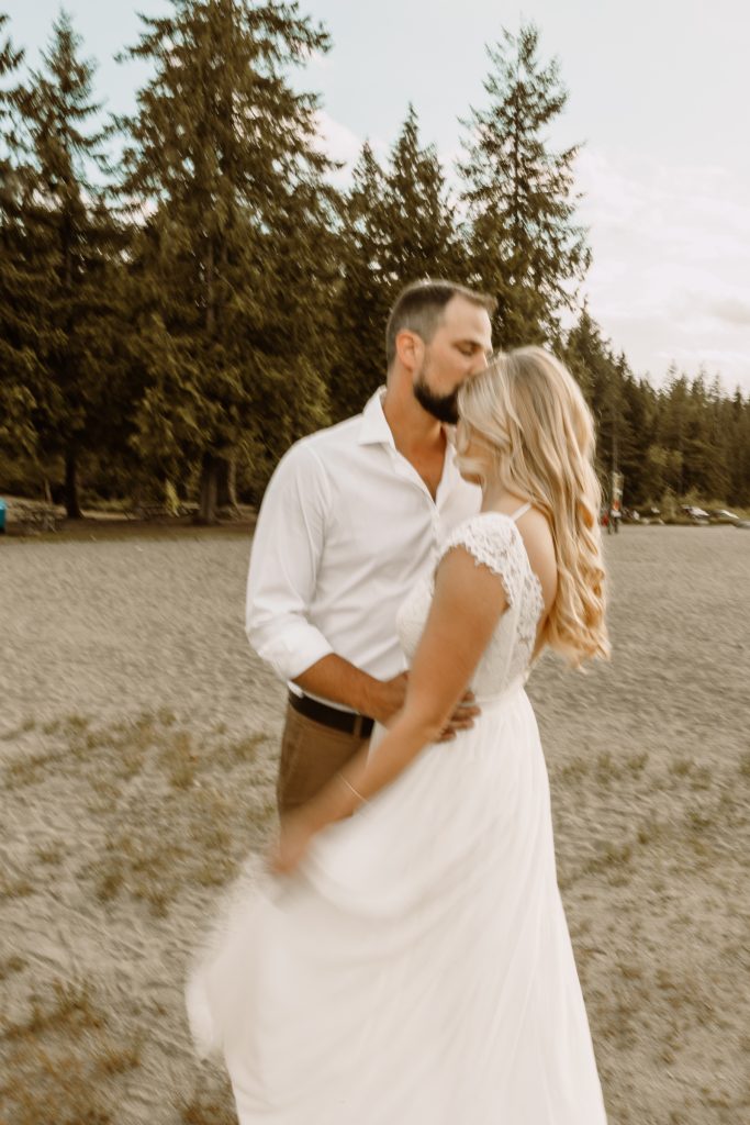 Candid laughter by Whonnock Lake at sunset, Fraser Valley wedding photography
