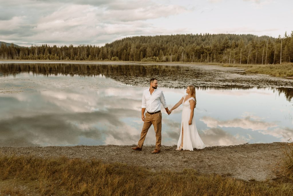 Intimate moment amidst tranquil lily pads, natural outdoor engagement session