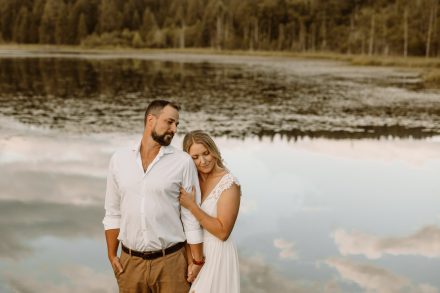 Intimate moment amidst tranquil lily pads, natural outdoor engagement session