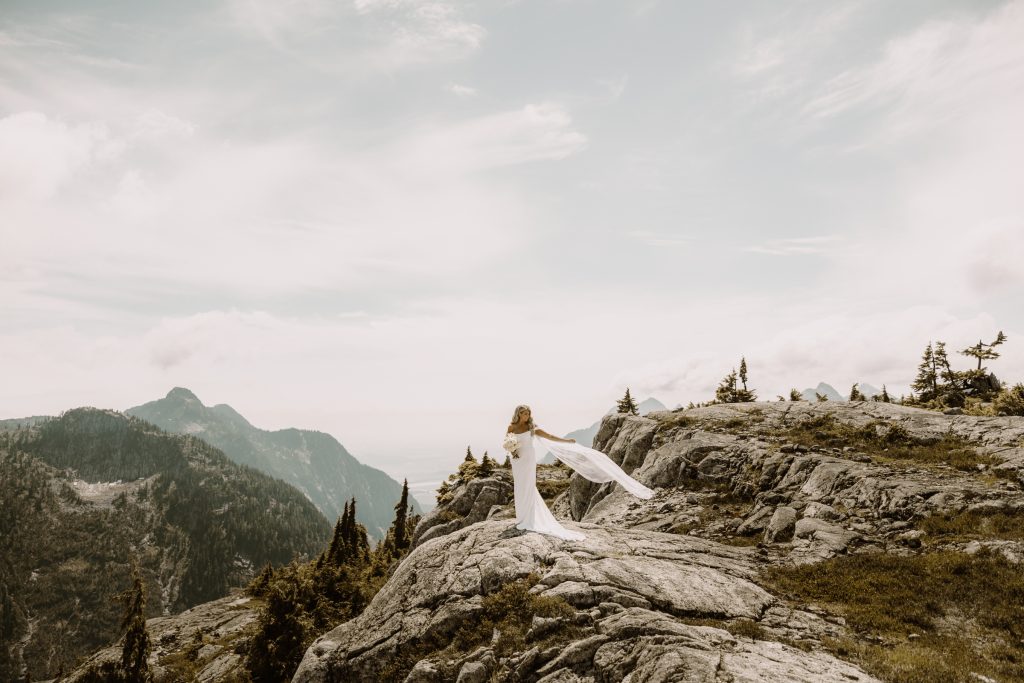 Helicopter elopement at the top of the mountain peeks over the fraser valley. Helicopter flight with Sky helicopters. bridal portraits