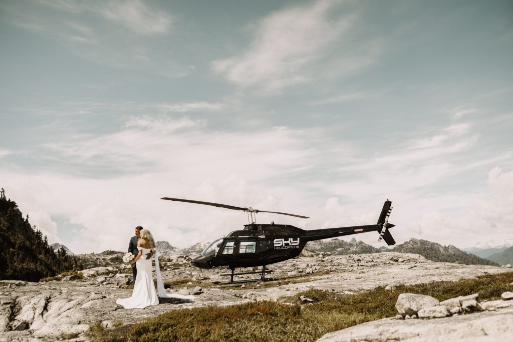 Helicopter elopement at the top of the mountain peeks over the fraser valley. Helicopter flight with Sky helicopters