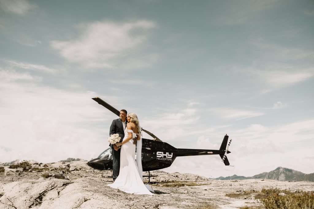 Helicopter elopement at the top of the mountain peeks over the fraser valley. Helicopter flight with Sky helicopters