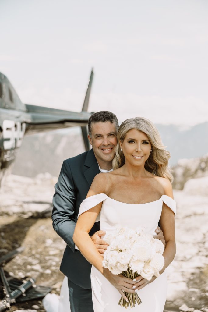 Helicopter elopement at the top of the mountain peeks over the fraser valley. Helicopter flight with Sky helicopters