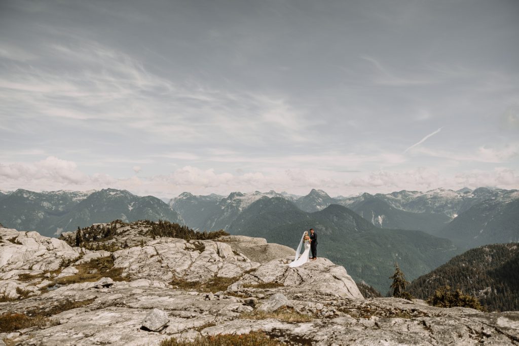 Helicopter elopement at the top of the mountain peeks over the fraser valley. Helicopter flight with Sky helicopters
