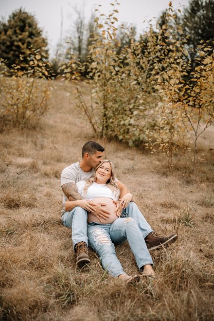 Anticipation and love shine in this candid maternity photo with partner.