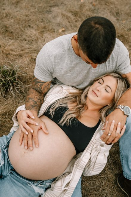 Expecting mom enjoys a serene park setting during her maternity photoshoot