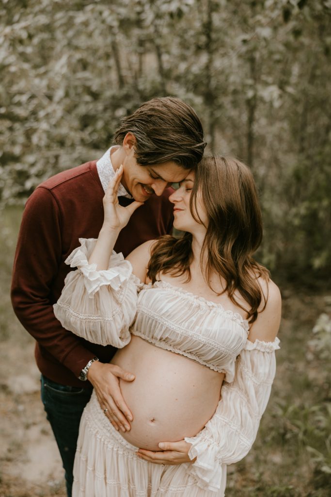 Joyful expectant mom in a beautiful meadow in Fraser Valley, BC, capturing precious maternity moments