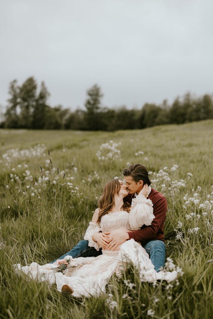 Joyful expectant mom in a beautiful meadow in Fraser Valley, BC, capturing precious maternity moments