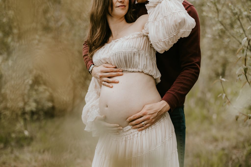 Joyful expectant mom in a beautiful meadow in Fraser Valley, BC, capturing precious maternity moments