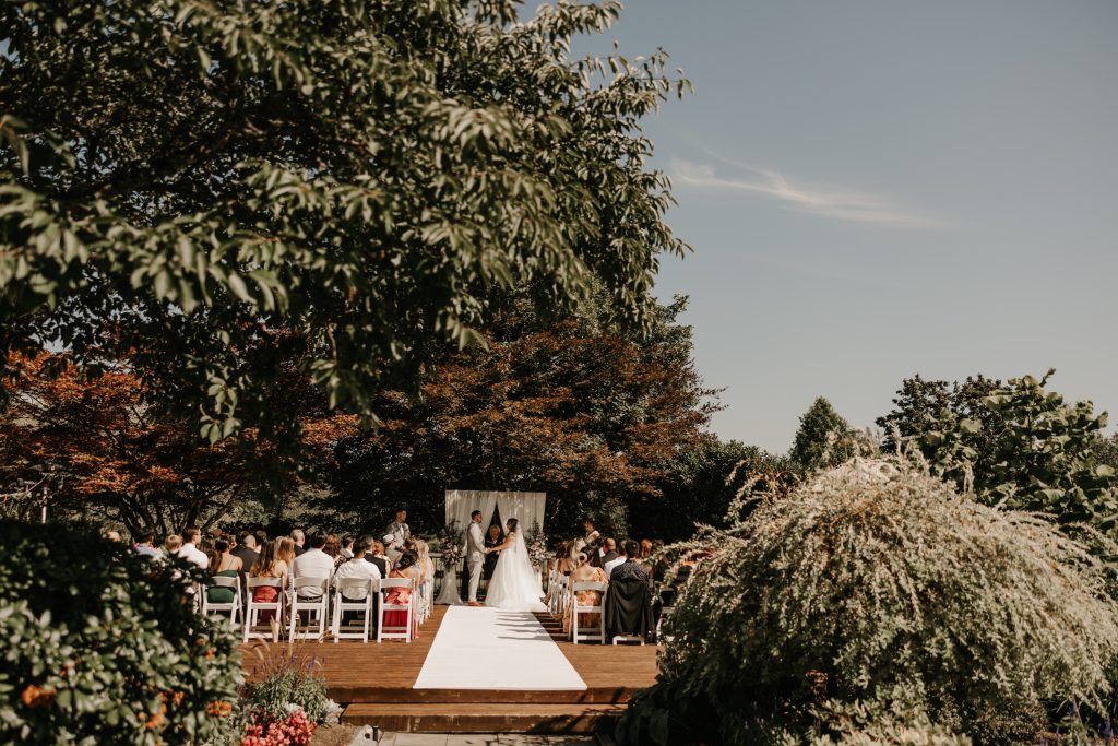 Newlyweds sharing a kiss at the stunning Swaneset Bay Resort and Country Club in Pitt Meadows.