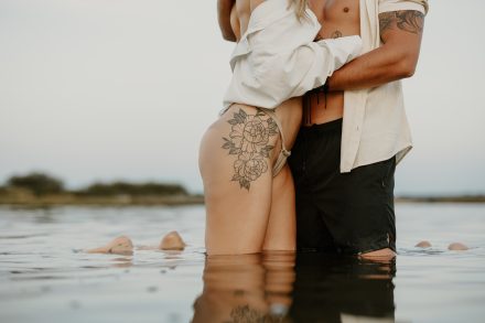 Tender moment captured of couple leaning into each other in Vancouver’s tidal waters
