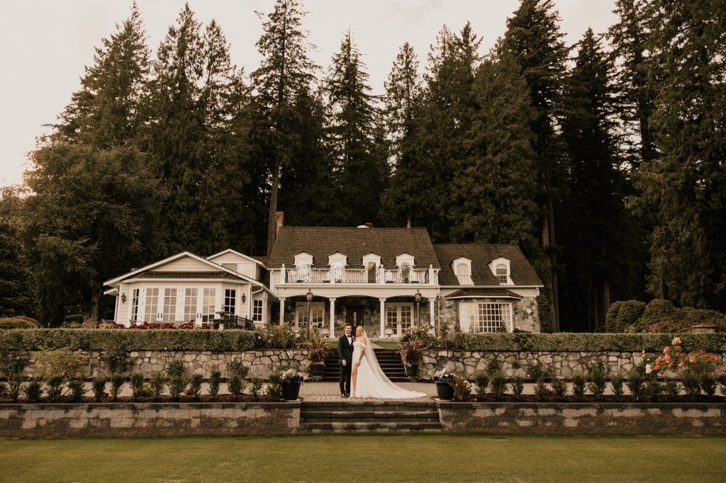 Bride and groom in front of Rowenas on the rivers house