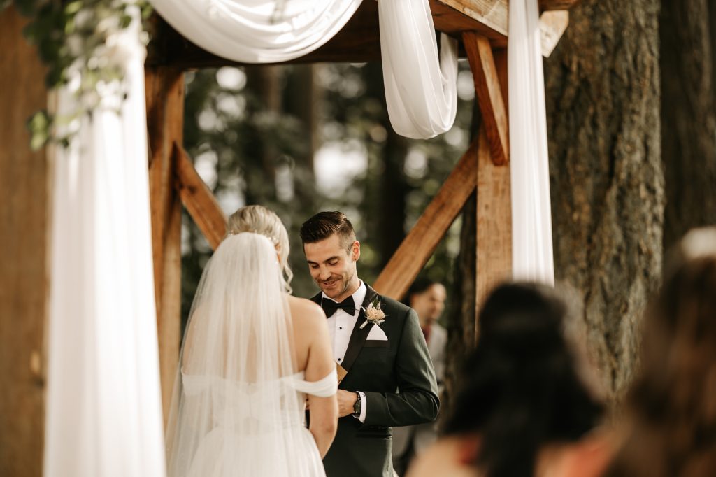 Couple exchanging vows with emotional expressions and joyful tears