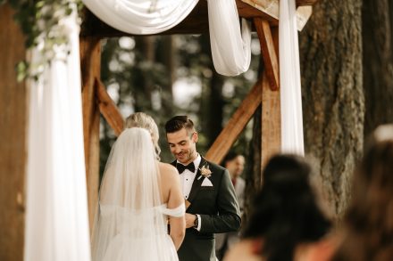 Couple exchanging vows with emotional expressions and joyful tears