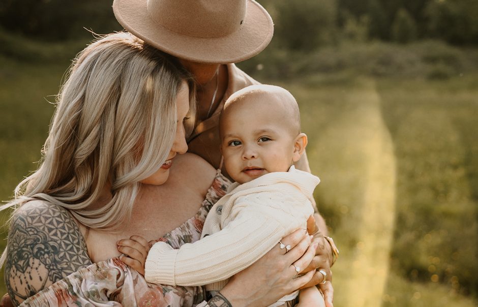 Tender family portrait in golden light, full of soft smiles and connection