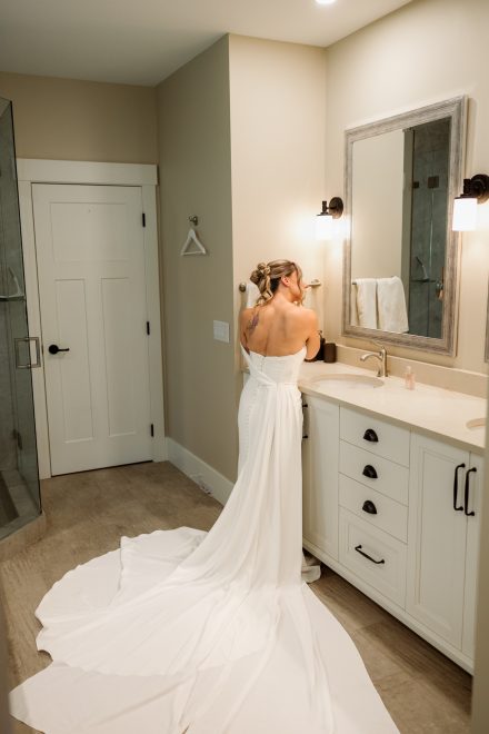 Bride putting the finishing touches on her look