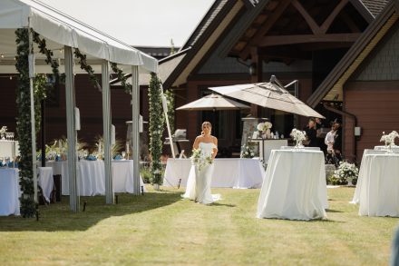Melissa walking down the aisle at her family backyard wedding in Abbotsford