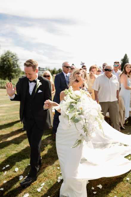 Parker and Melissa sharing a funny, almost kiss moment as they met at the front of the isle