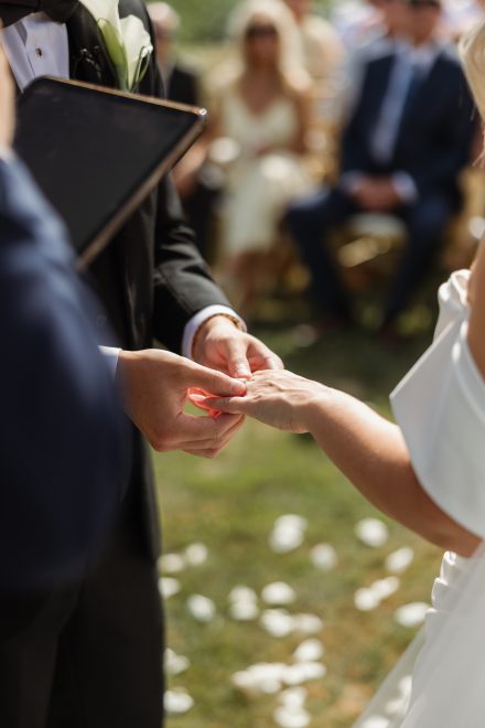 Ring exchange during an intimate backyard ceremony in the Fraser Valley