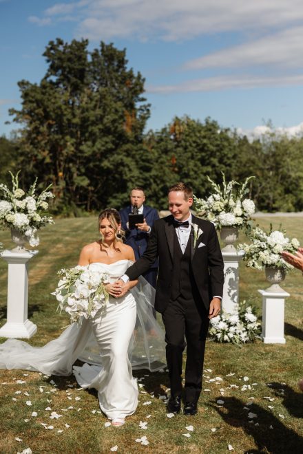 Guests watching an emotional ceremony moment at a family backyard wedding in Abbotsford, BC