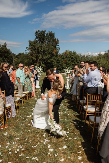 Guests watching an emotional ceremony moment at a family backyard wedding in Abbotsford, BC
