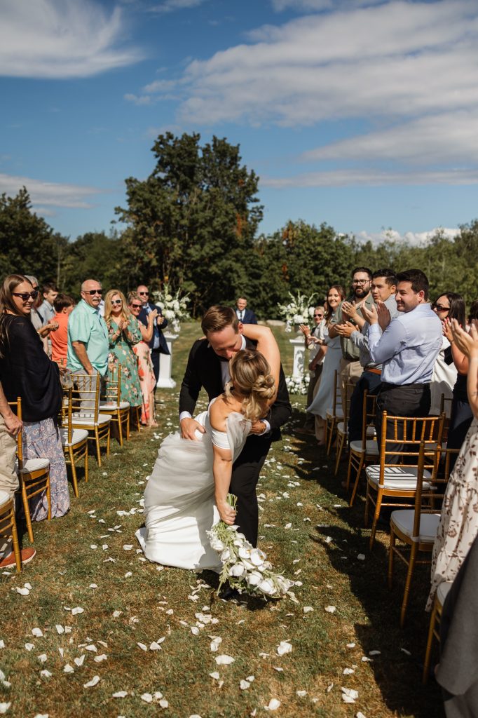 Guests watching an emotional ceremony moment at a family backyard wedding in Abbotsford, BC