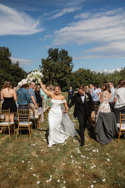 Guests watching an emotional ceremony moment at a family backyard wedding in Abbotsford, BC