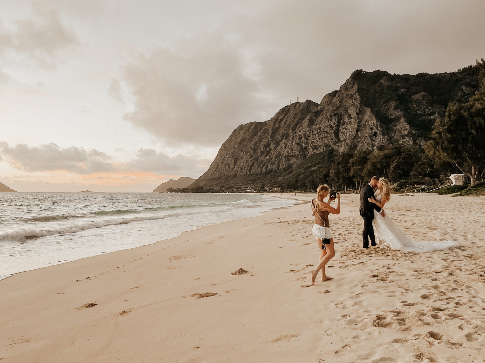 Behind the scenes: Kate photographing a bride during a wedding in Hawaii