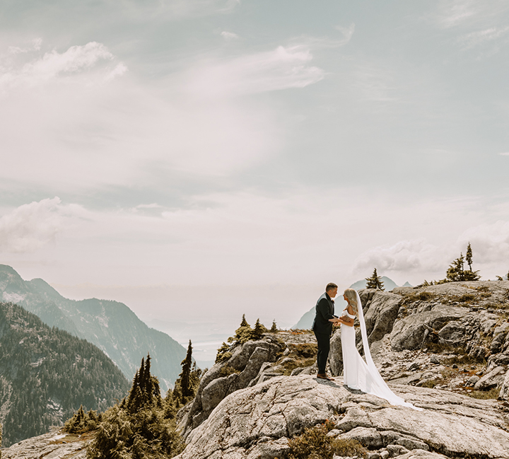 Kim and Eric beside a helicopter on their elopement day in the Fraser Valley