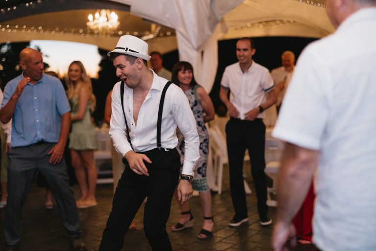 Guests dance and laugh at the reception